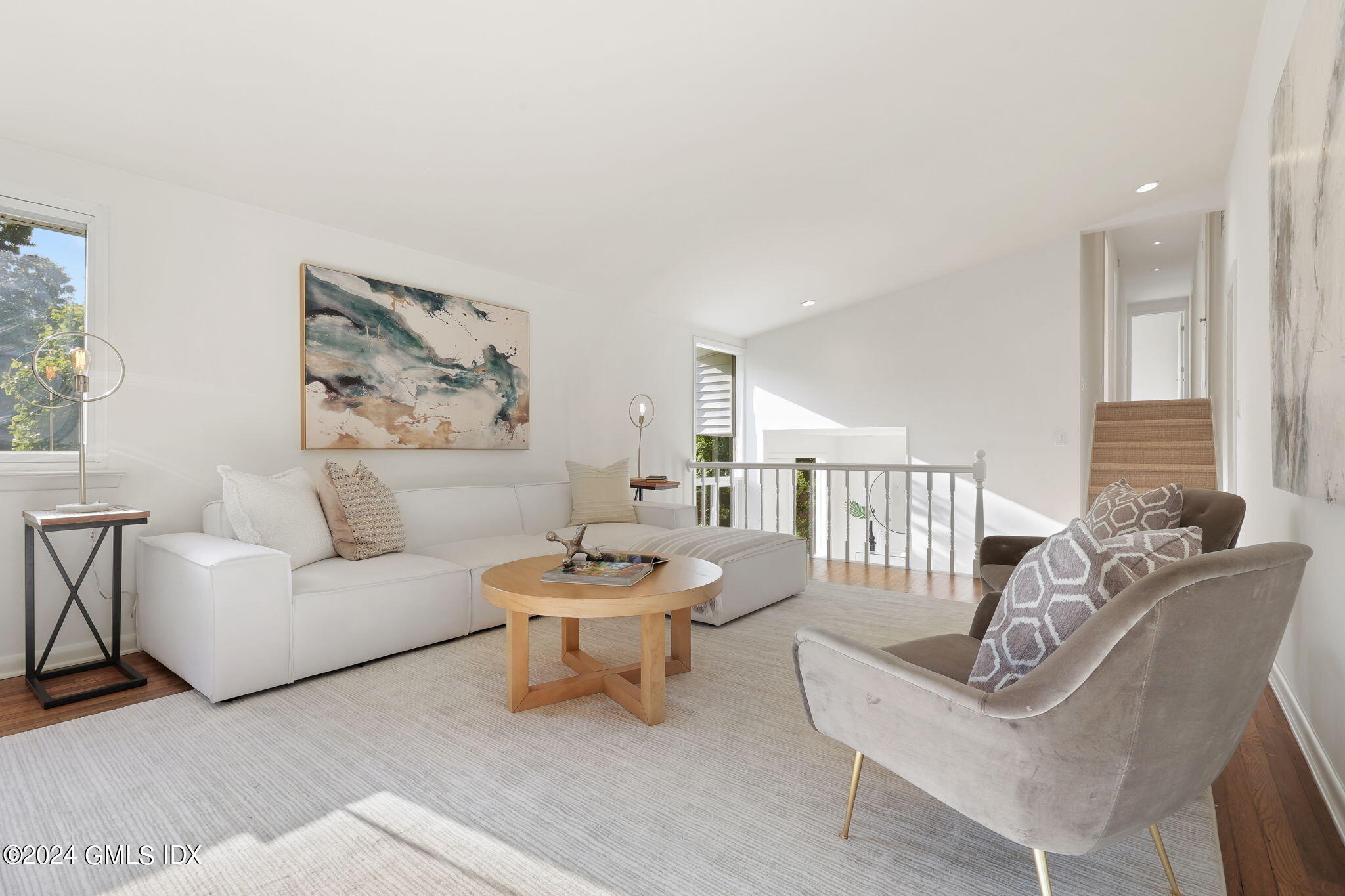 18 Crawford Terrace Riverside, CT 06878 - Photo 4 of 31 a living room with furniture and a painting on the wall