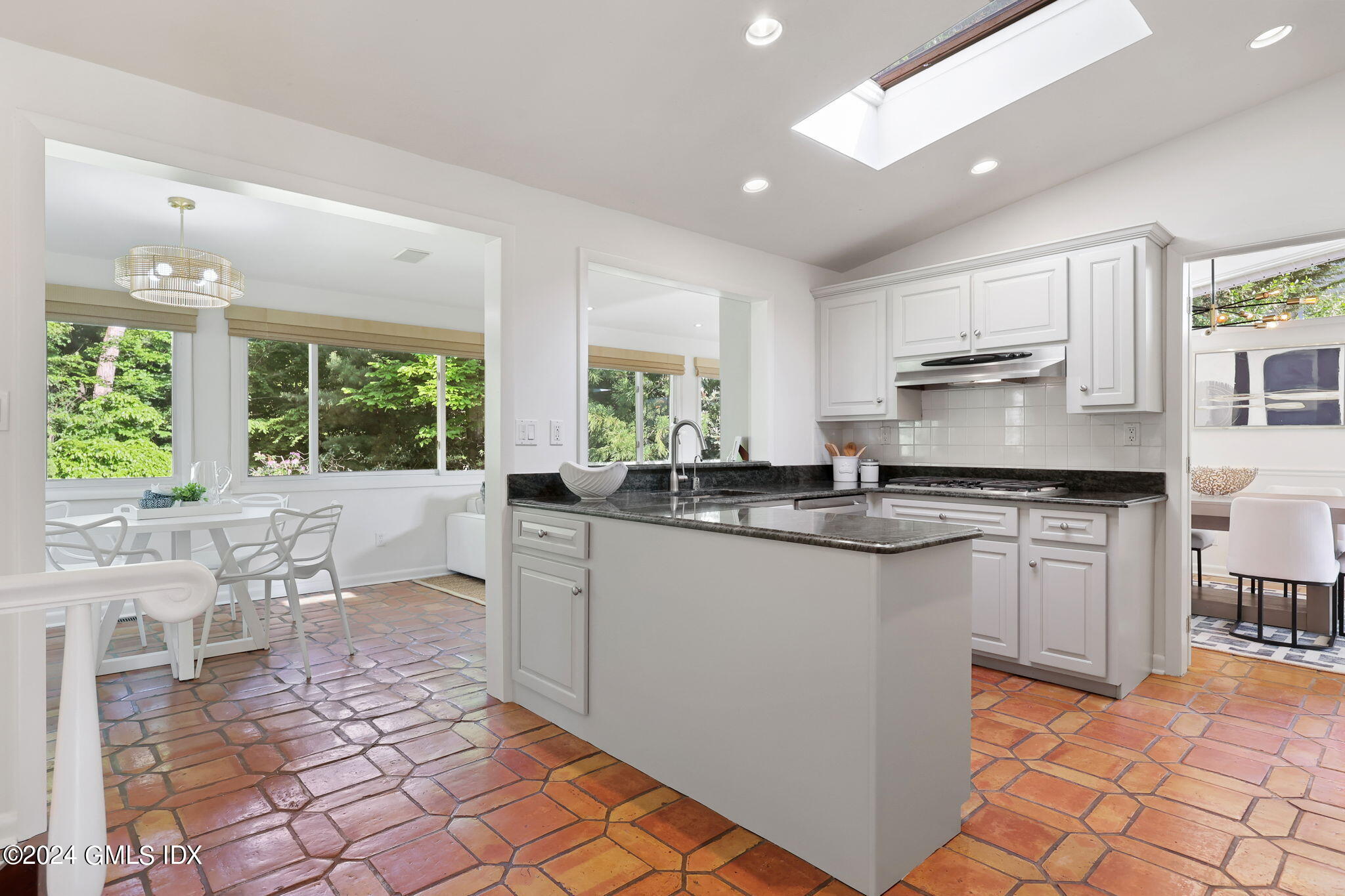 18 Crawford Terrace Riverside, CT 06878 - Photo 9 of 31 a kitchen with granite countertop a sink cabinets and window