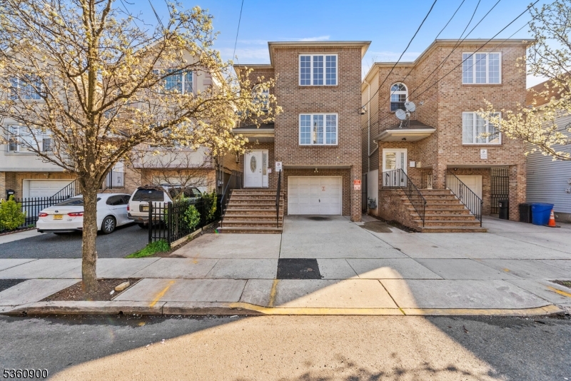 427 Fulton Street, Unit 2 Elizabeth Port, NJ 07206 - Photo 1 of 17 a front view of a building with street view