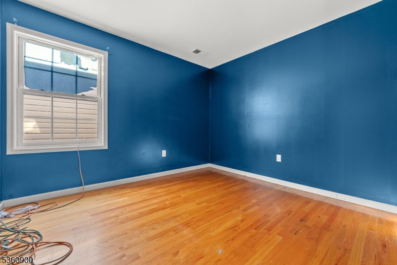 427 Fulton Street, Unit 2 Elizabeth Port, NJ 07206 - Photo 13 of 17 an empty room with windows