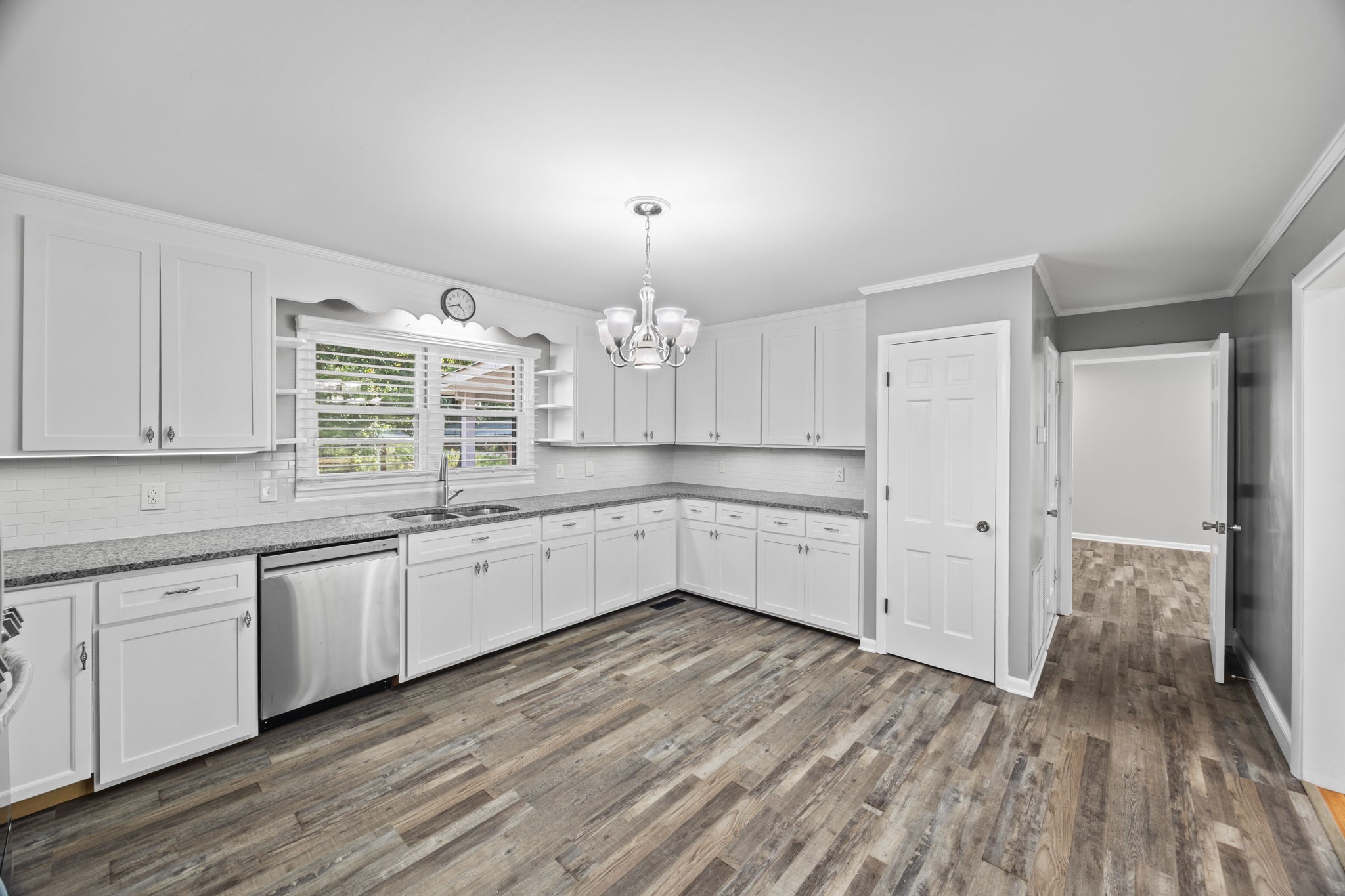 6510 Clemons Ridge Road Silver Point, TN 38582 - Photo 11 of 44 a large kitchen with granite countertop a white stove top oven and white cabinets