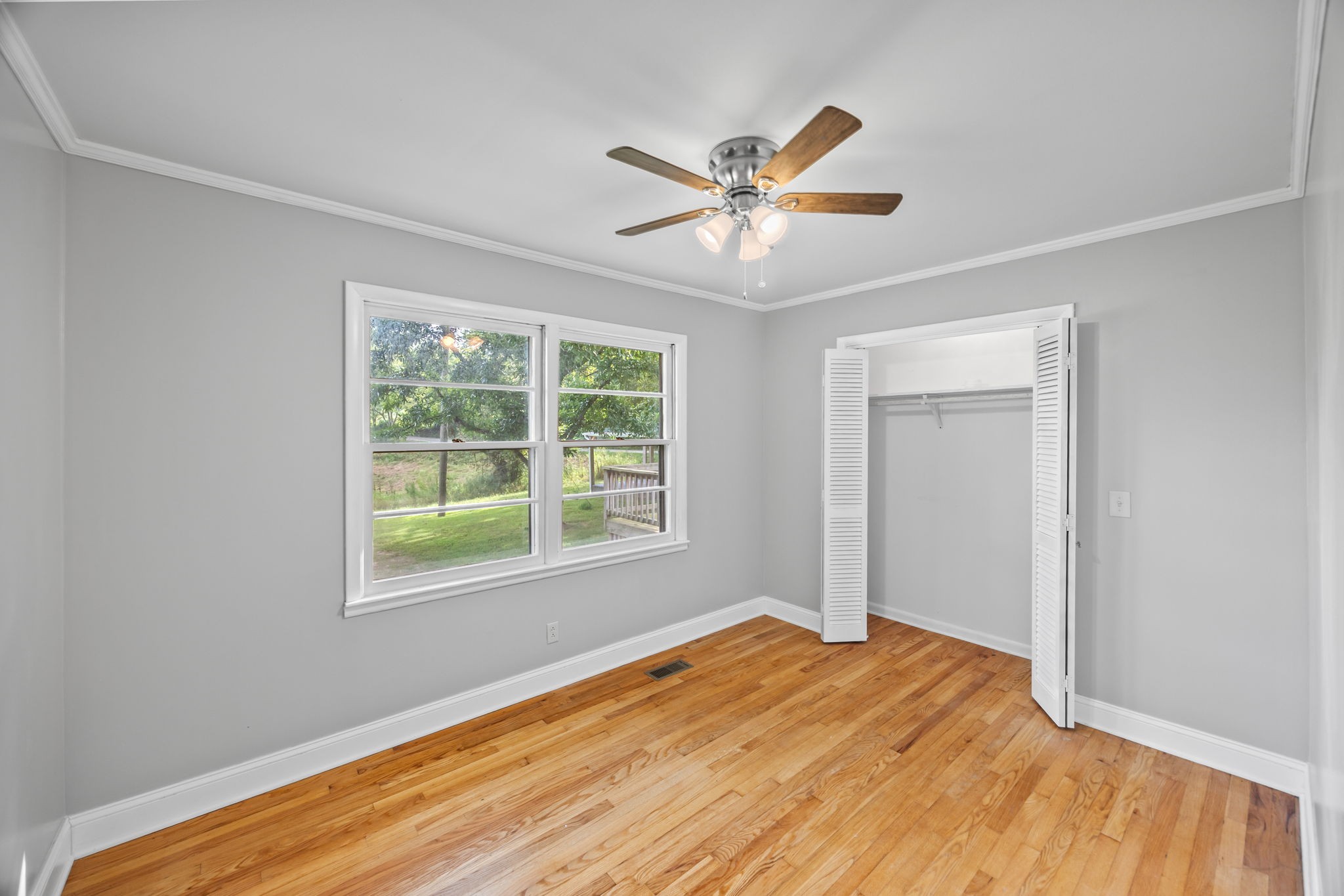 6510 Clemons Ridge Road Silver Point, TN 38582 - Photo 13 of 44 a view of empty room with wooden floor and fan