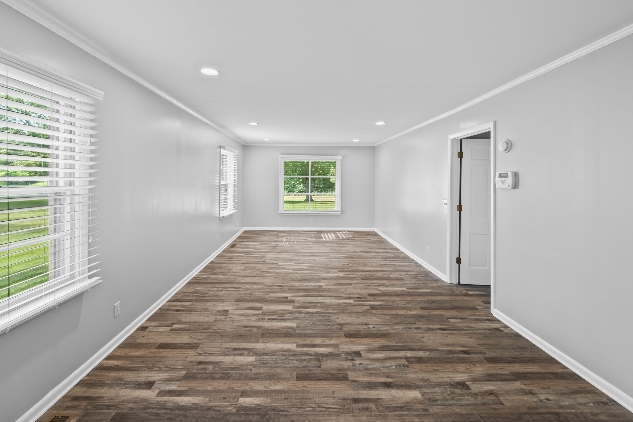 6510 Clemons Ridge Road Silver Point, TN 38582 - Photo 21 of 44 a view of an empty room with wooden floor and a window