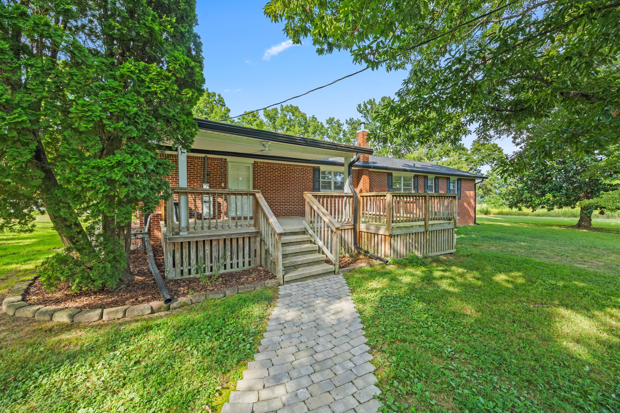 6510 Clemons Ridge Road Silver Point, TN 38582 - Photo 27 of 44 a view of a house with a yard and a garden