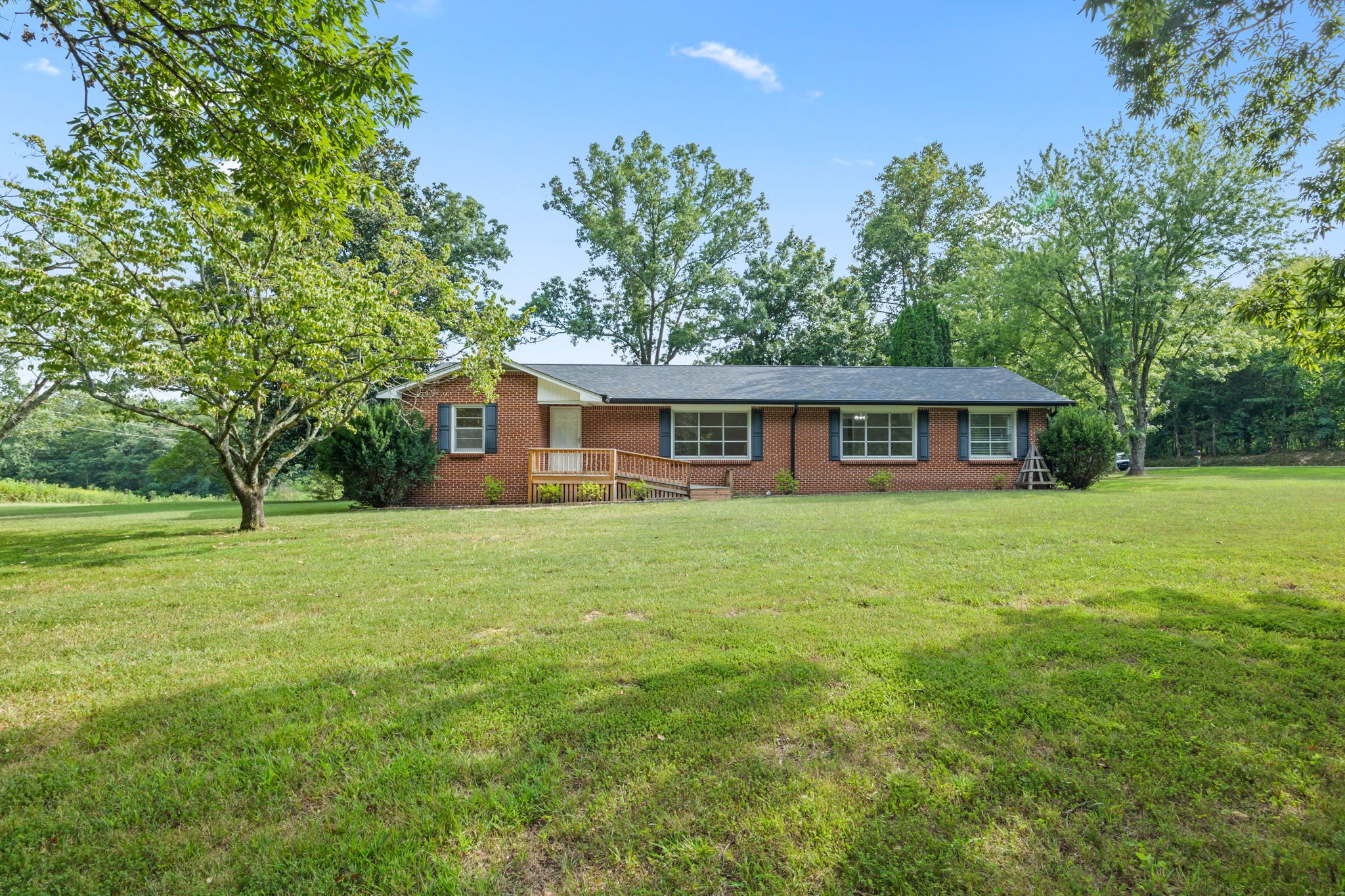 6510 Clemons Ridge Road Silver Point, TN 38582 - Photo 31 of 44 a backyard of a house with table and chairs
