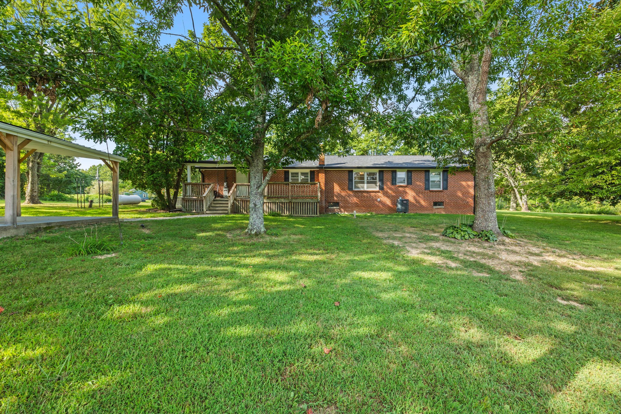 6510 Clemons Ridge Road Silver Point, TN 38582 - Photo 33 of 44 a view of a house with backyard and a tree