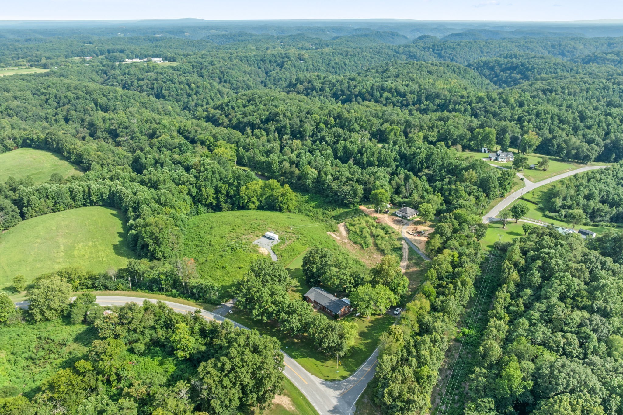 6510 Clemons Ridge Road Silver Point, TN 38582 - Photo 37 of 44 an aerial view of residential houses with outdoor space and trees