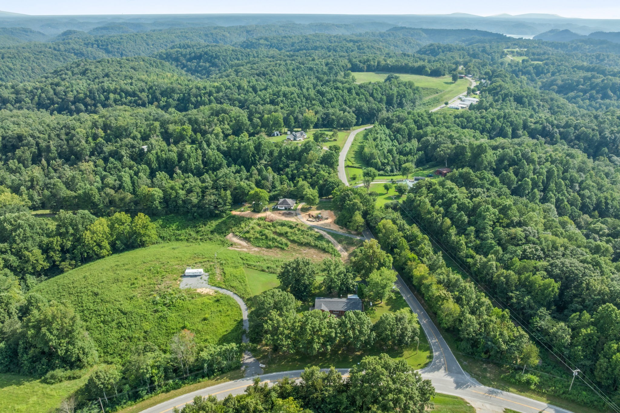 6510 Clemons Ridge Road Silver Point, TN 38582 - Photo 38 of 44 an aerial view of residential houses with outdoor space and trees