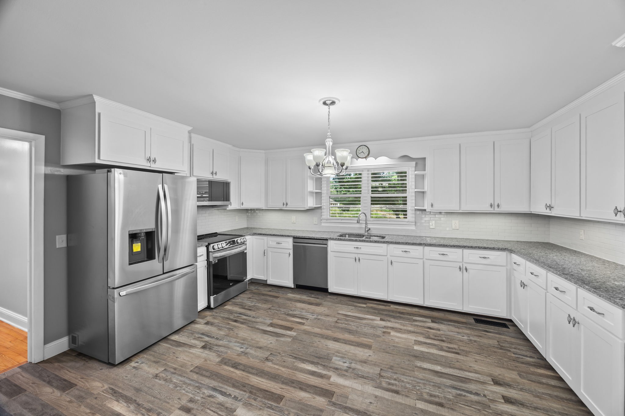 6510 Clemons Ridge Road Silver Point, TN 38582 - Photo 9 of 44 a kitchen with granite countertop stainless steel appliances a sink cabinets and counter space