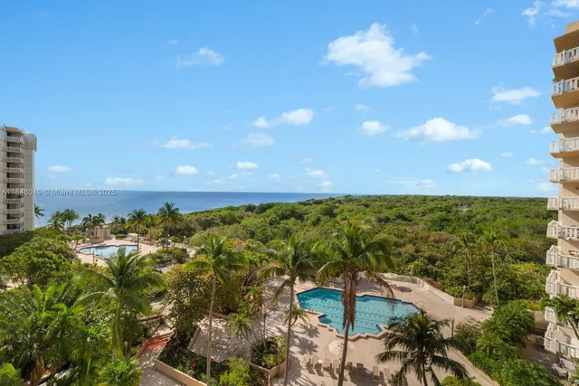 a bedroom with furniture and a flat screen tv
