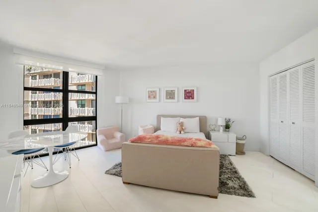 a bedroom with a bed and a closet