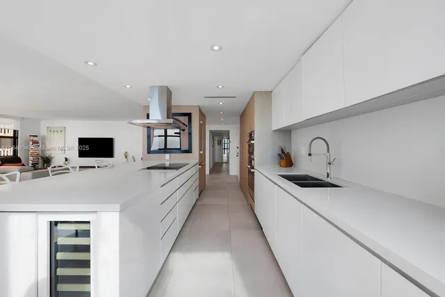 a large kitchen with a stove and cabinets