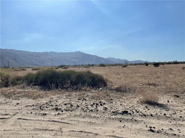 a view of a lake with mountains in the background