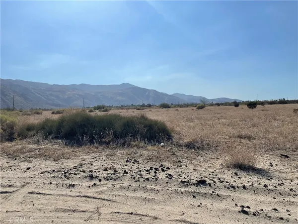 a view of a lake with mountains in the background