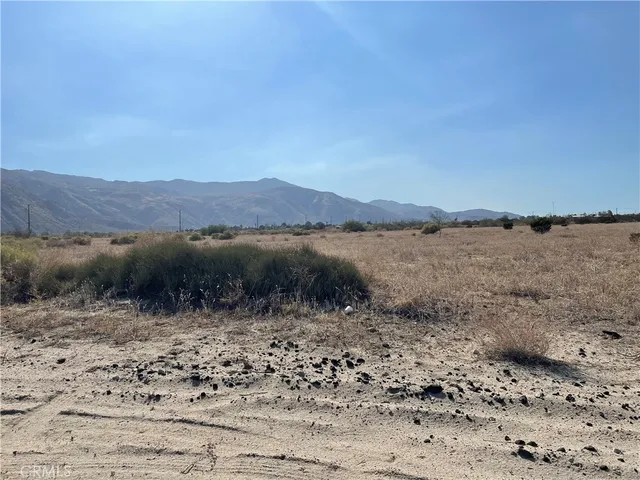 a view of a lake with mountains in the background