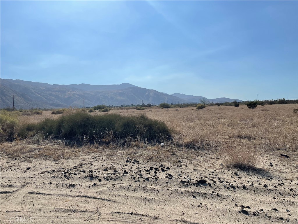 0 Olive Street Cabazon, CA 92230 - Photo 5 of 13 a view of a lake with mountains in the background