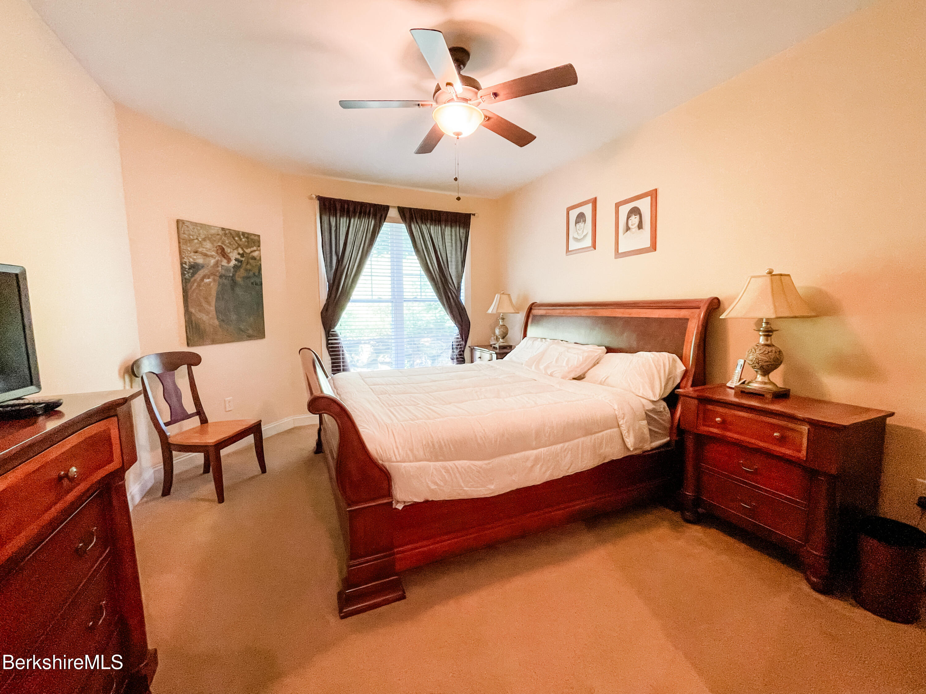 22 Alpine Trail Pittsfield, MA 01201 - Photo 12 of 35 a bedroom with a bed and a chandelier