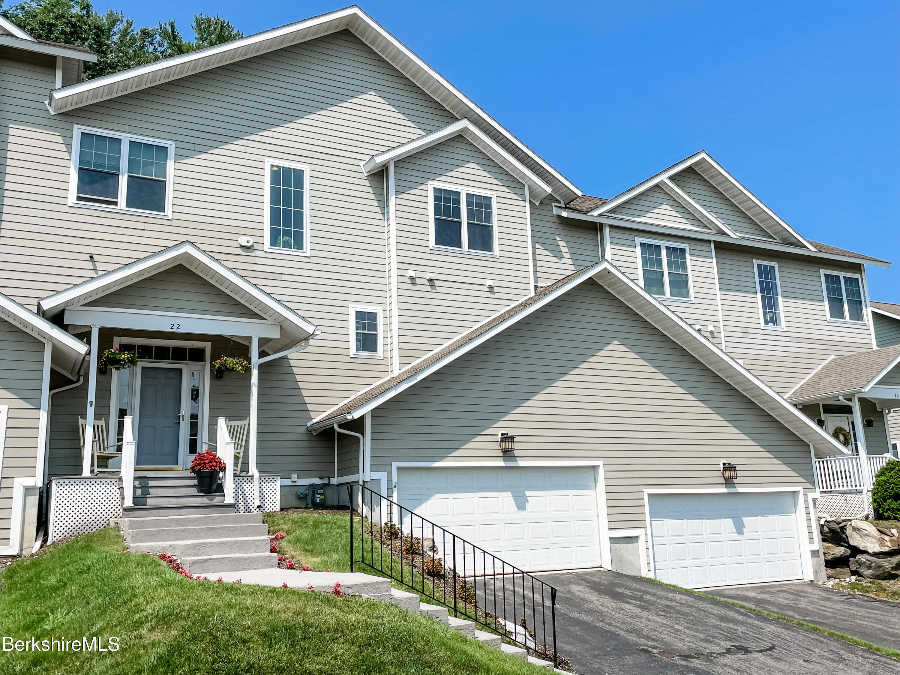 22 Alpine Trail Pittsfield, MA 01201 - Photo 2 of 35 a view of a house with a yard and lawn chairs with wooden fence