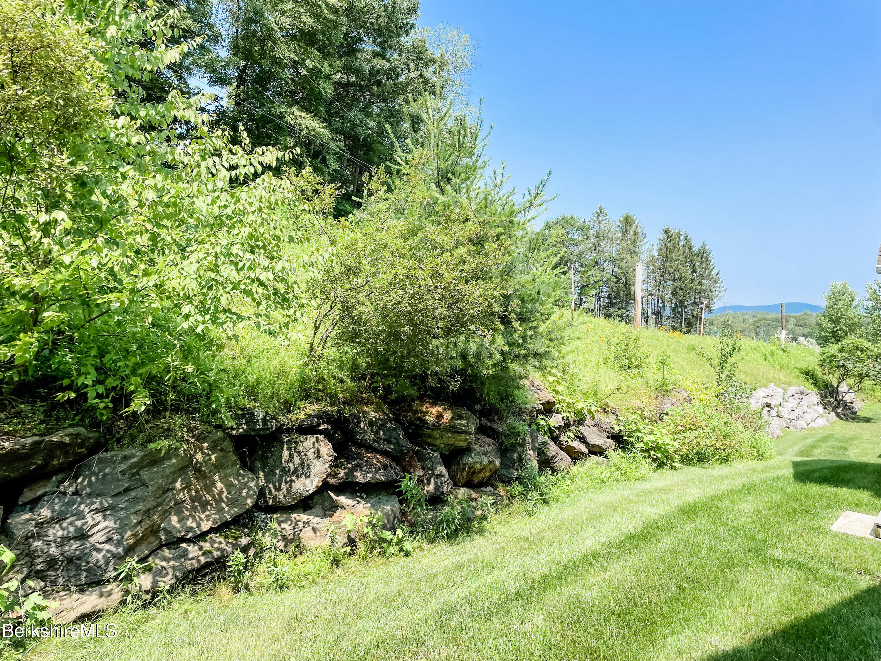 22 Alpine Trail Pittsfield, MA 01201 - Photo 3 of 35 a backyard of a house with lots of green space