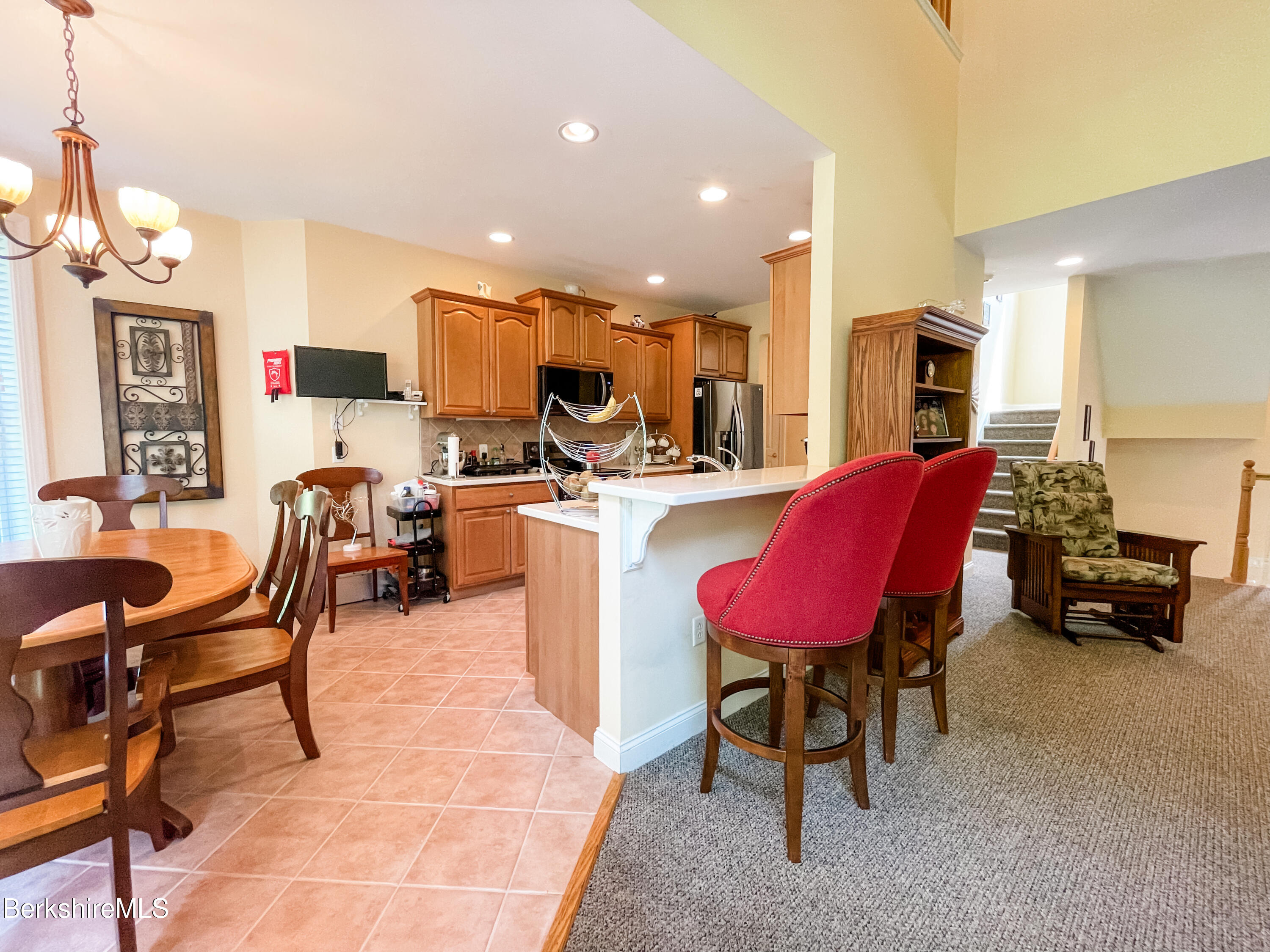 22 Alpine Trail Pittsfield, MA 01201 - Photo 9 of 35 a living room with furniture kitchen view and a wooden floor