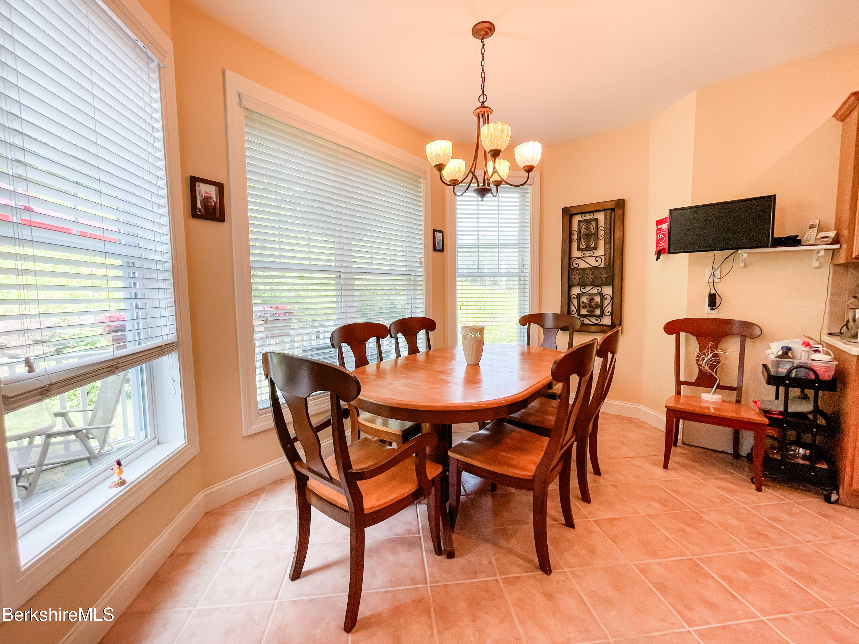 22 Alpine Trail Pittsfield, MA 01201 - Photo 10 of 35 a view of a dining room with furniture a chandelier and wooden floor