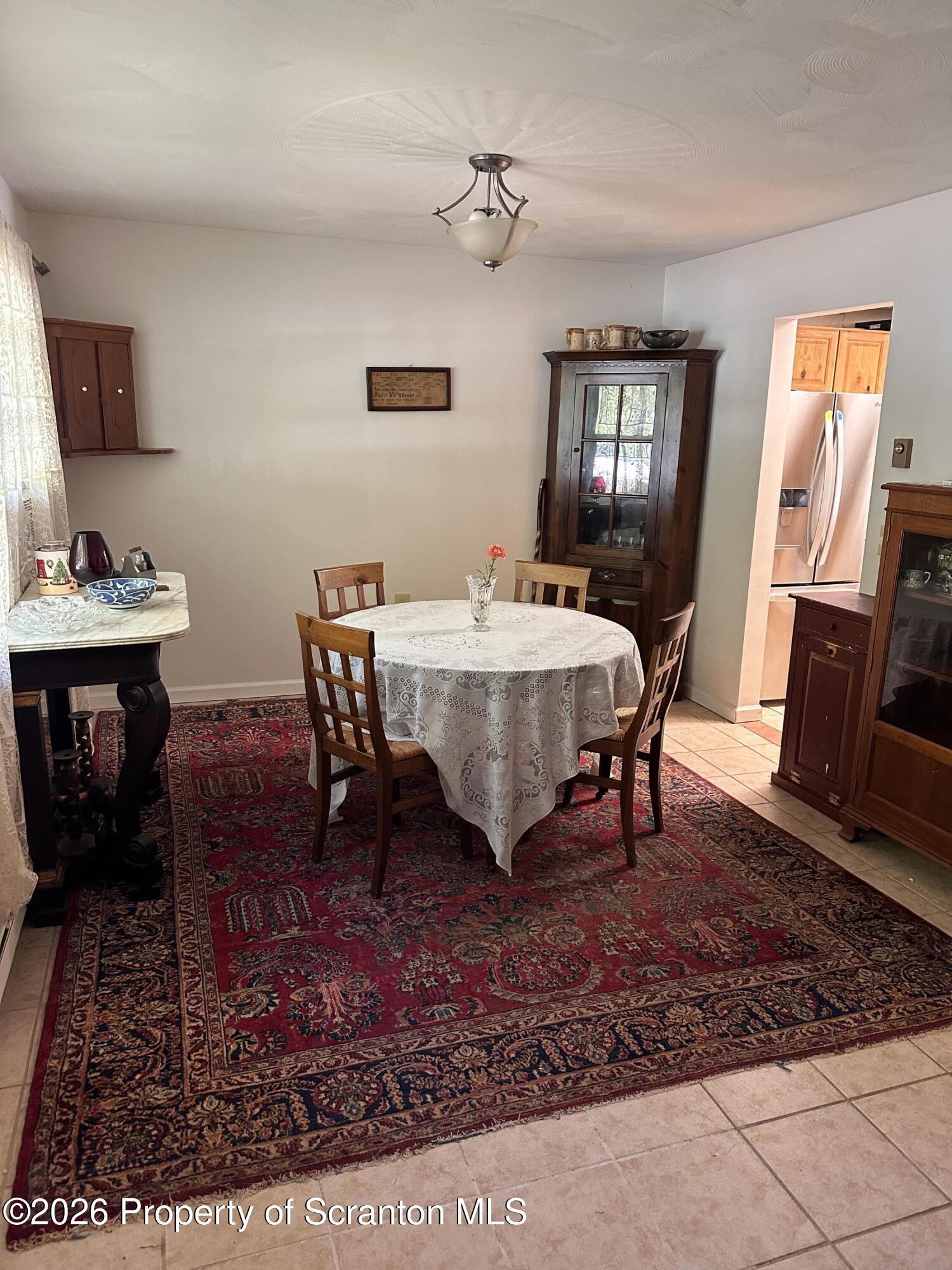 107 Keystone Hls Road, Unit 405 Factoryville, PA 18419 - Photo 4 of 27 a view of a dining room with furniture