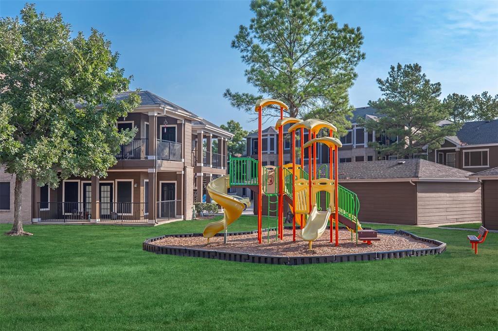 12035 Huffmeister Road, Unit 101032 Cypress, TX 77429 - Photo 15 of 16 a view of a house with a park