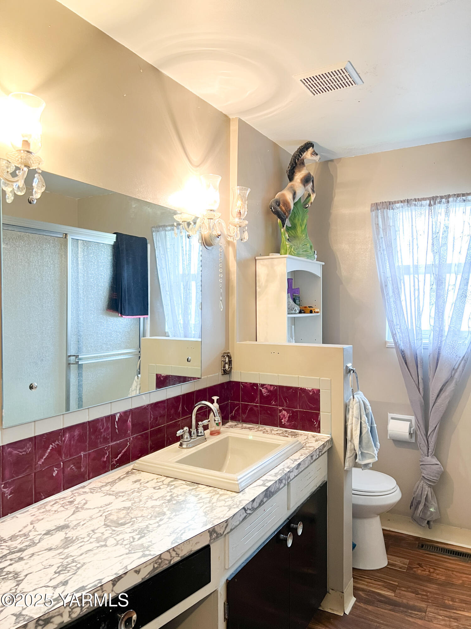 1341 Cemetery Road Sunnyside, WA 98944 - Photo 12 of 18 a bathroom with a granite countertop sink and a mirror