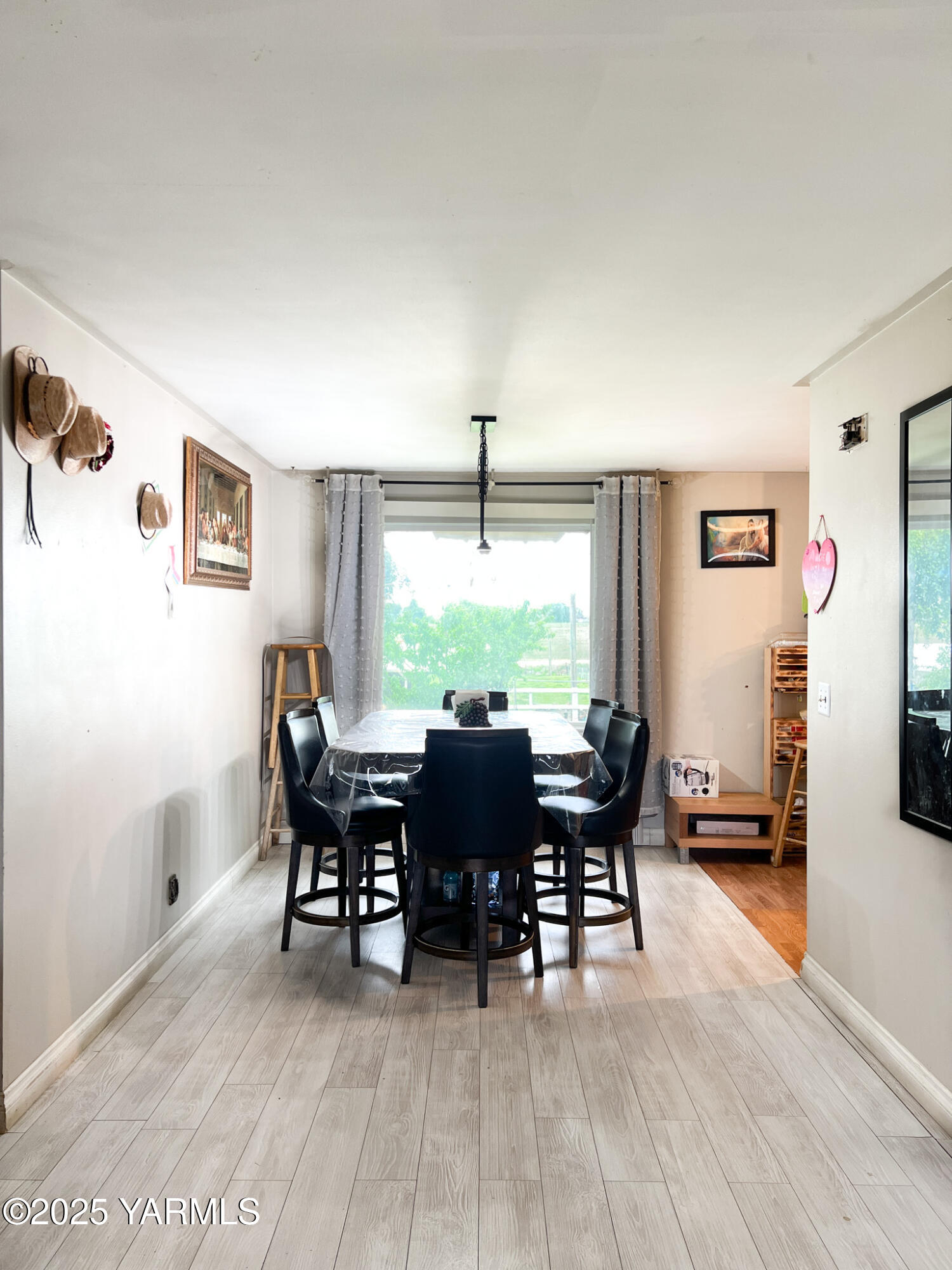 1341 Cemetery Road Sunnyside, WA 98944 - Photo 9 of 18 a view of a dining room with furniture window and wooden floor