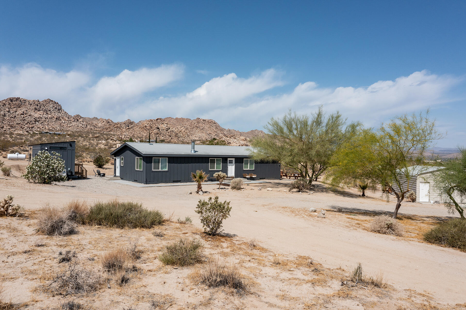 7122 Sunkist Road Joshua Tree, CA 92252 - Photo 1 of 61 a view of a house with a snow in the background