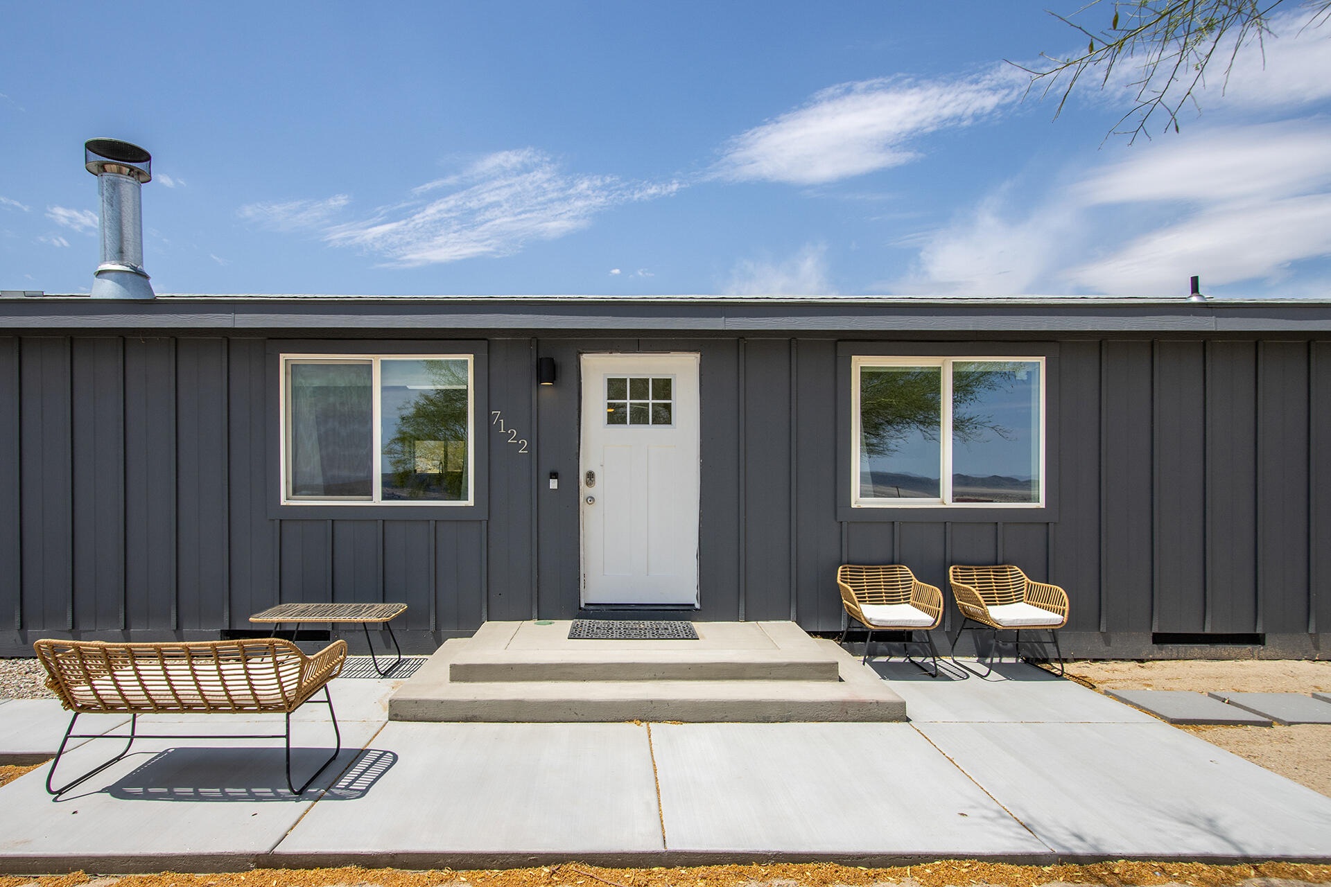 7122 Sunkist Road Joshua Tree, CA 92252 - Photo 26 of 61 a building outdoor space with patio furniture and potted plants