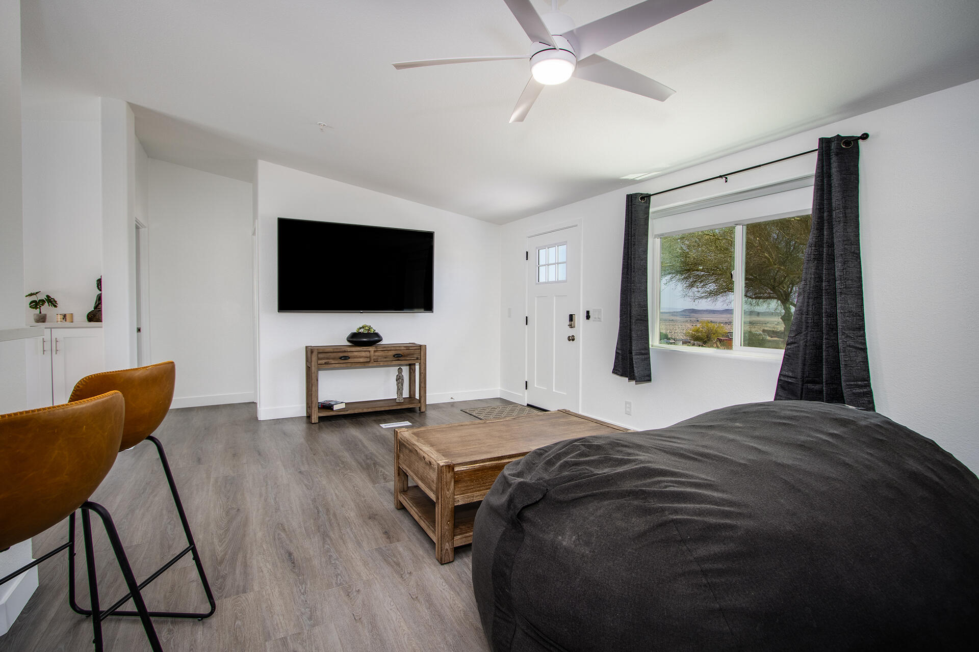 7122 Sunkist Road Joshua Tree, CA 92252 - Photo 30 of 61 a bedroom with a bed and a flat screen tv