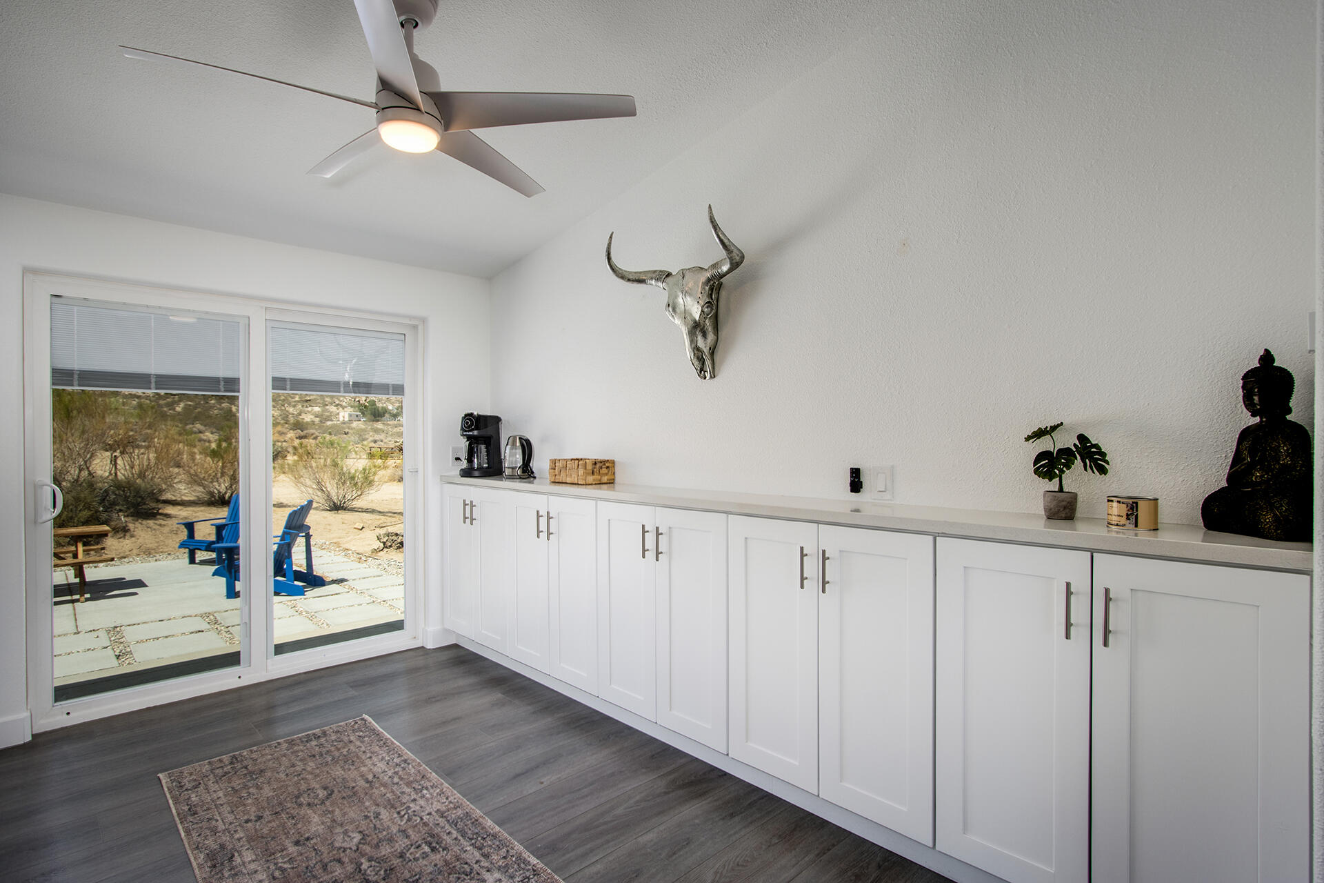 7122 Sunkist Road Joshua Tree, CA 92252 - Photo 33 of 61 a kitchen with white cabinets and window