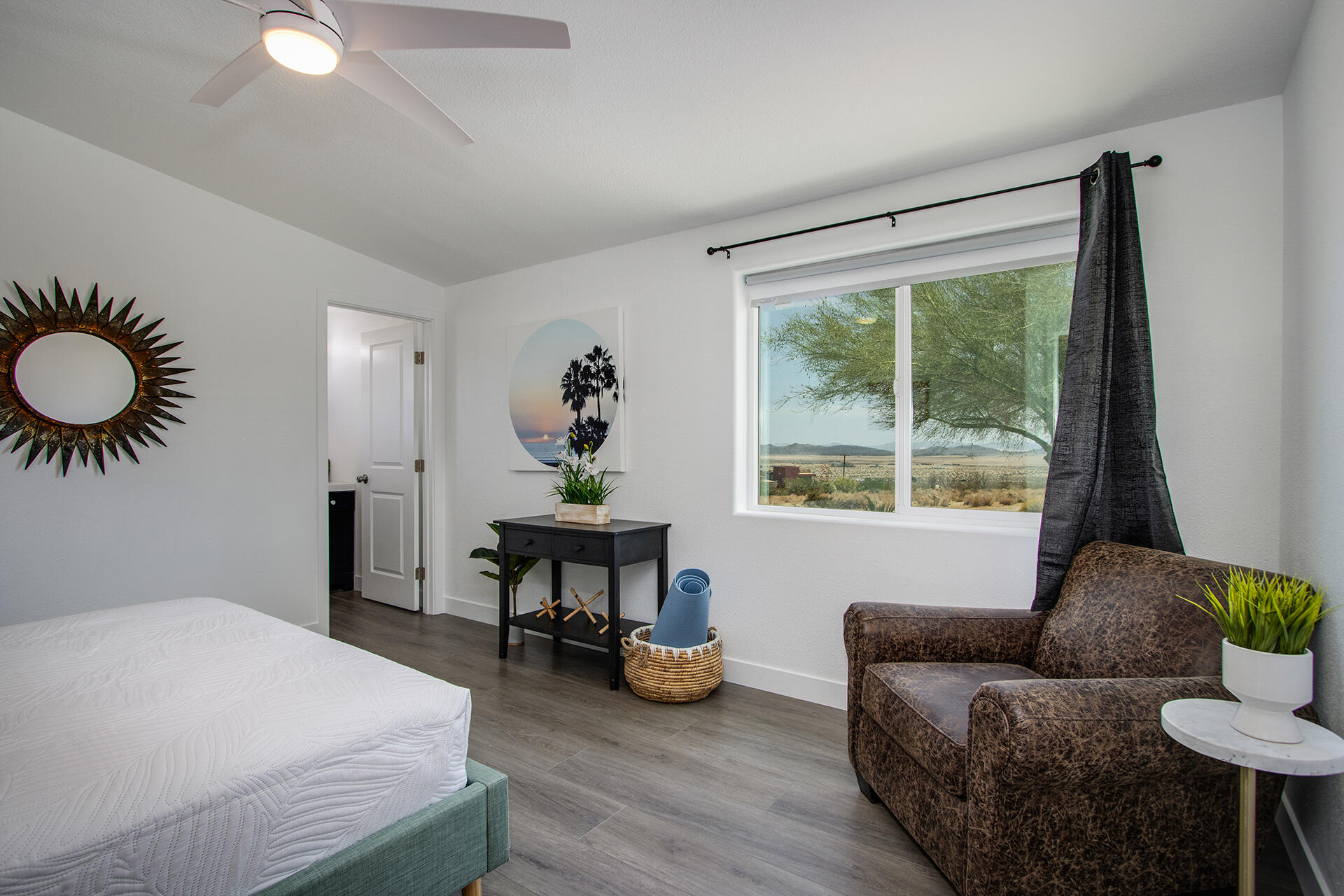 7122 Sunkist Road Joshua Tree, CA 92252 - Photo 57 of 61 a bedroom with furniture and a large window