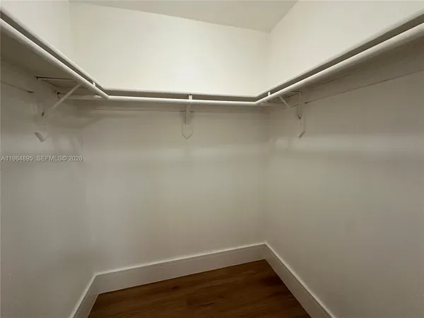 a view of an empty walk in closet