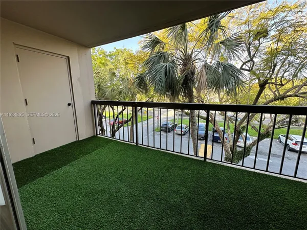 a view of a yard with a large trees