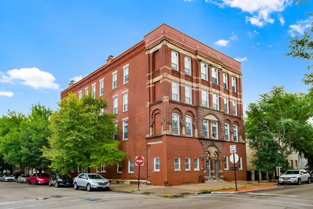 a tall building sitting on the side of a street