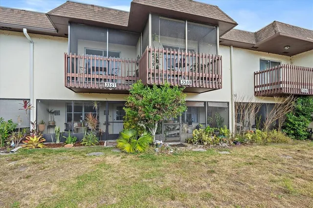 a front view of a building with garden