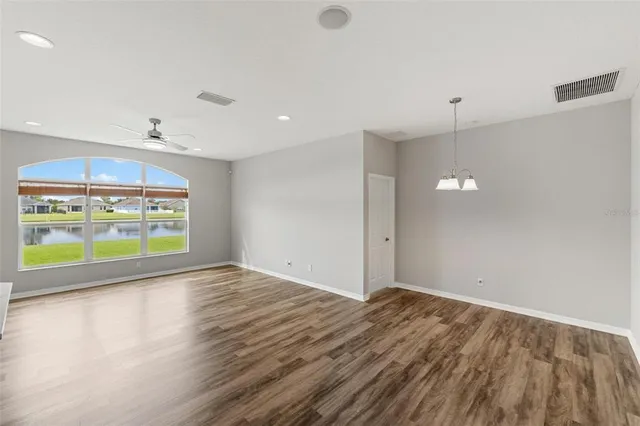 a view of kitchen with sink microwave and stove