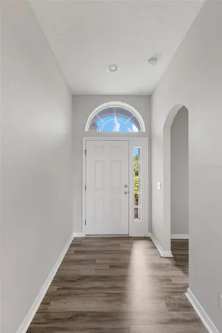 a kitchen with stainless steel appliances granite countertop a stove a sink dishwasher a refrigerator and a microwave oven with cabinets