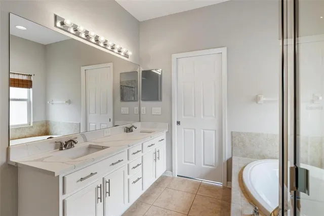 an aerial view of residential houses with outdoor space and swimming pool