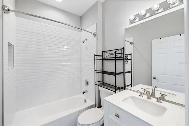 an aerial view of a house with a swimming pool outdoor seating and yard