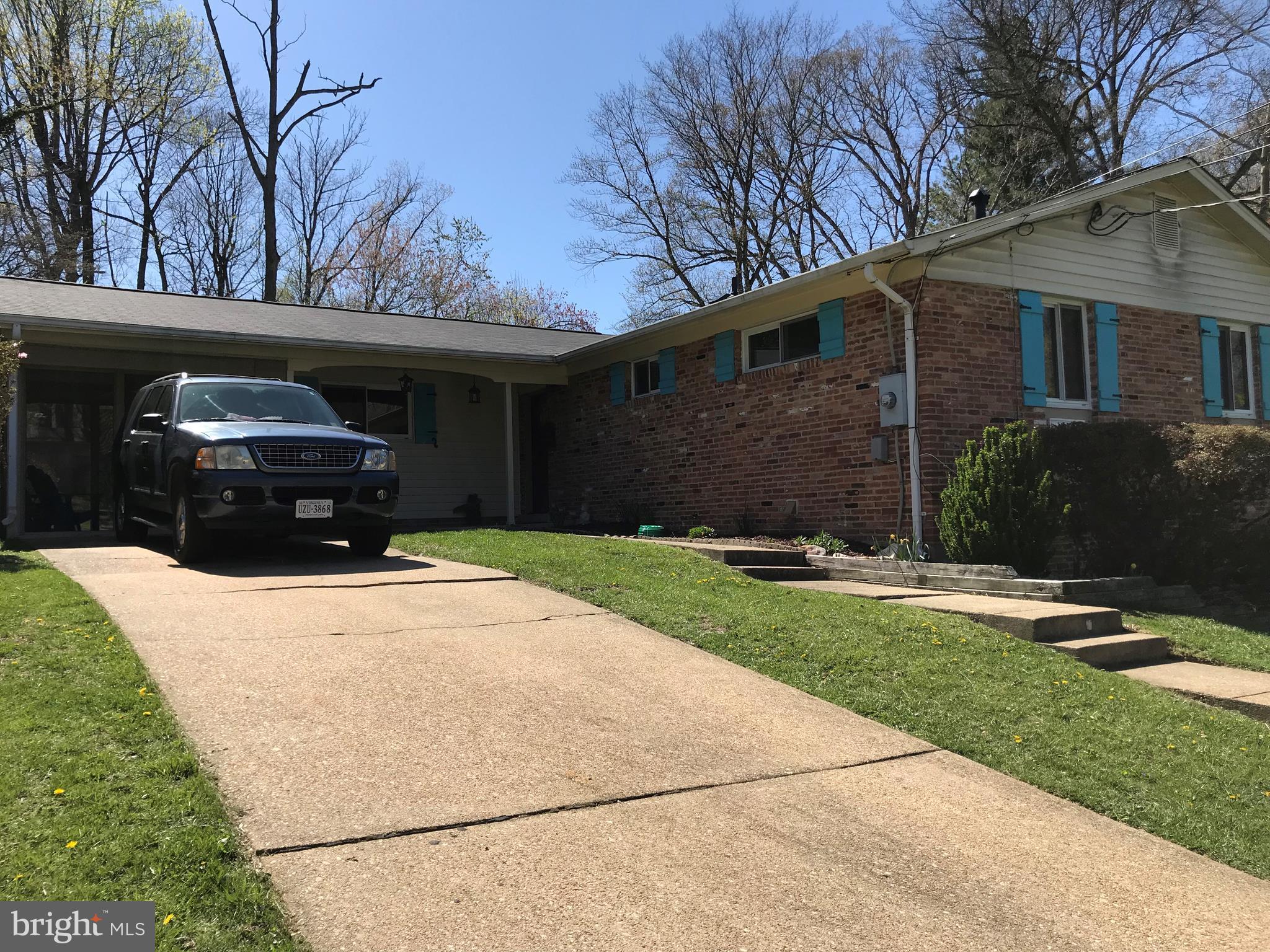 8645 Victoria Road Springfield, VA 22151 - Photo 1 of 19 a front view of a house with a yard