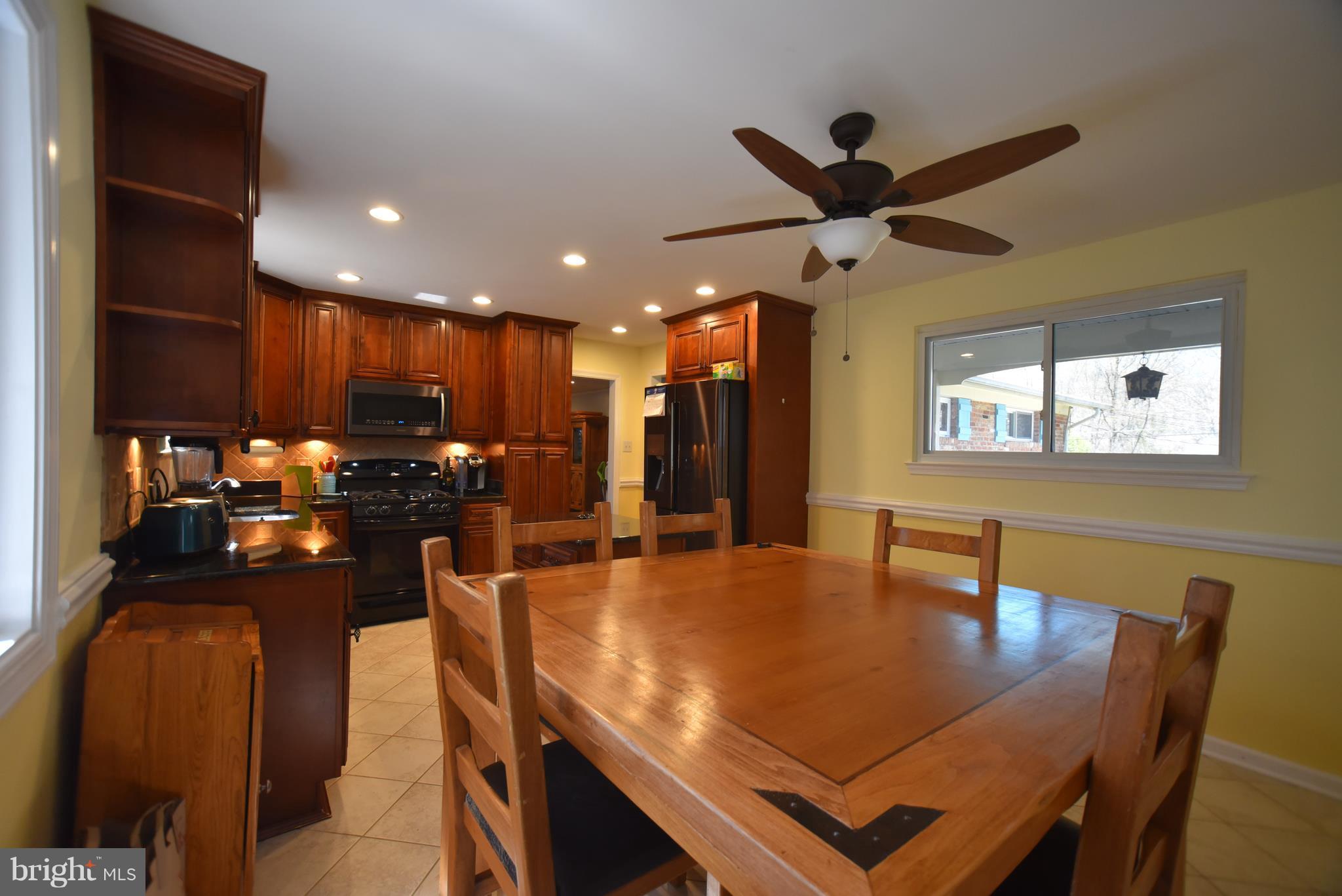 8645 Victoria Road Springfield, VA 22151 - Photo 5 of 19 a view of a dining room with furniture