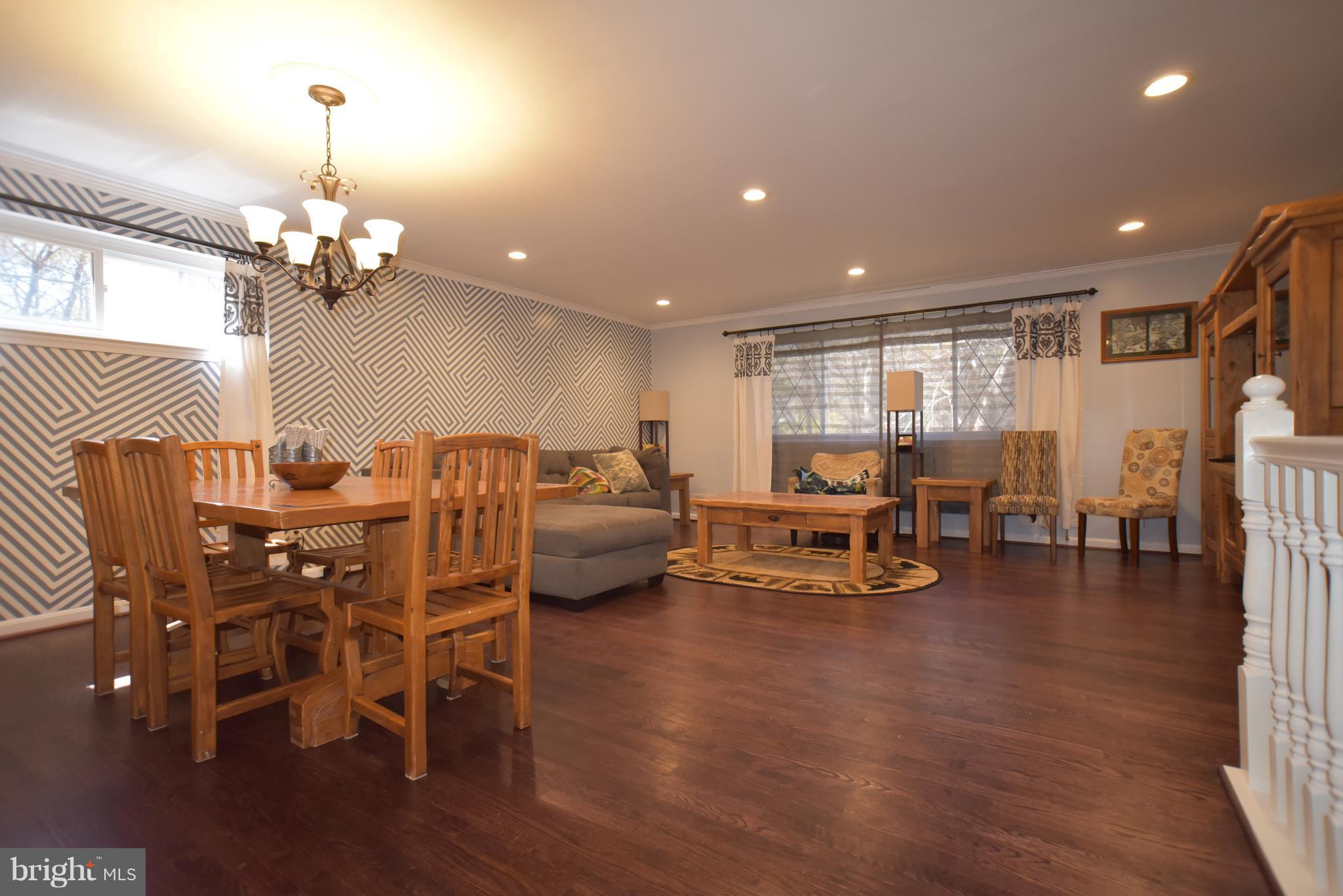 8645 Victoria Road Springfield, VA 22151 - Photo 19 of 19 a view of a livingroom with furniture and a chandelier