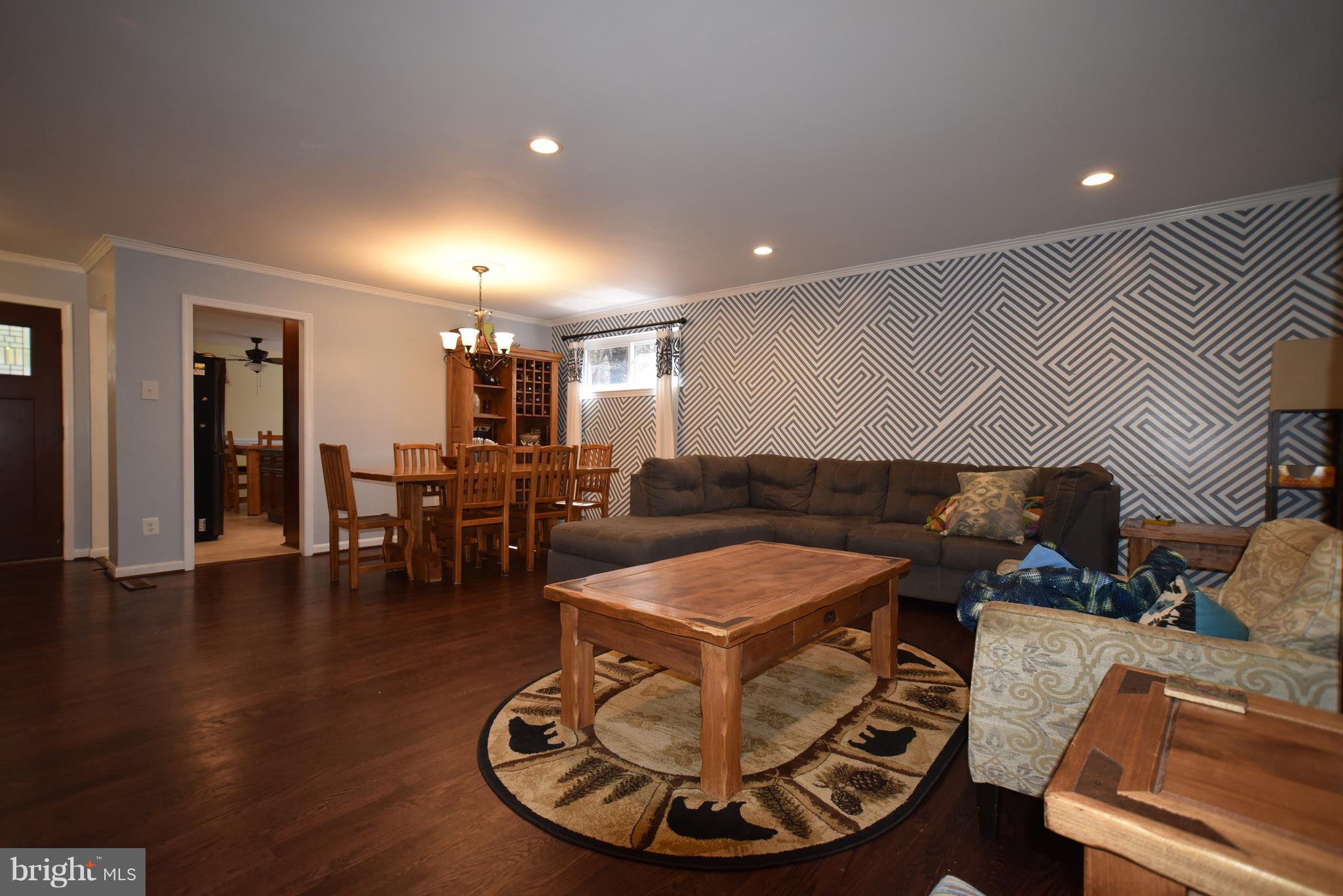 8645 Victoria Road Springfield, VA 22151 - Photo 8 of 19 a living room with furniture and a dining table