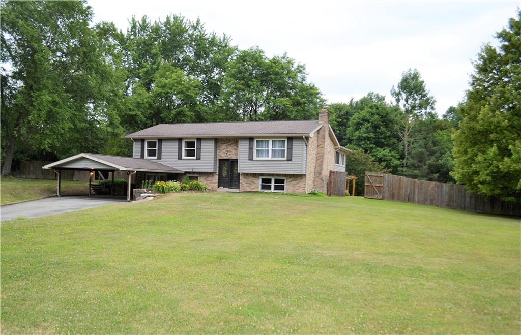 1129 Cheese Run Road Indiana, PA 15701 - Photo 1 of 25 a front view of a house with a garden