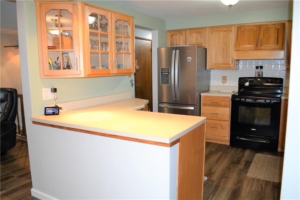 1129 Cheese Run Road Indiana, PA 15701 - Photo 6 of 25 a kitchen that has a refrigerator and a stove