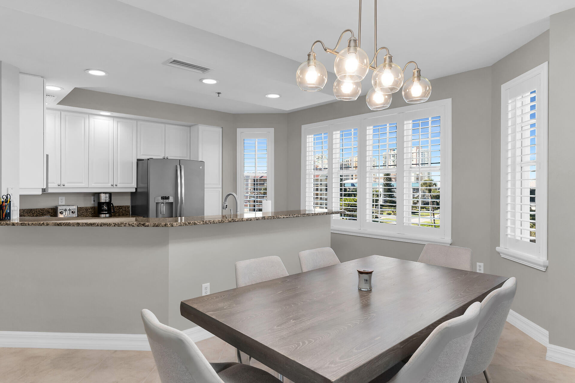 1111 Swallow Avenue, Unit 1401 Marco Island, FL 34145 - Photo 13 of 36 a view of a dining room with furniture and window