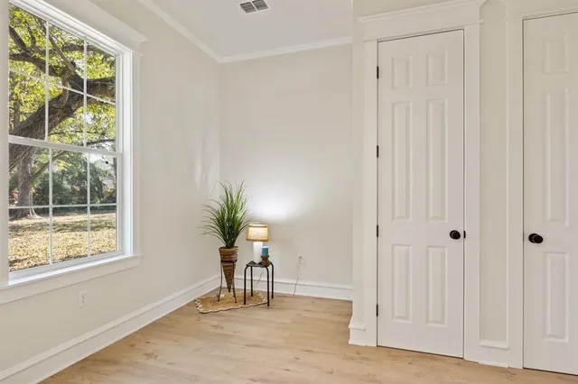a view of an entryway with wooden floor